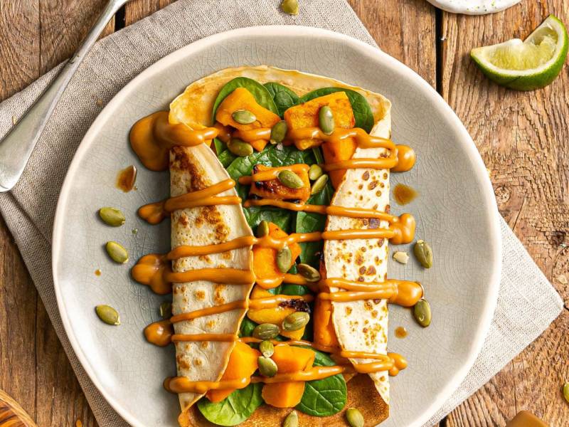 Squash with satay drizzle pancakes